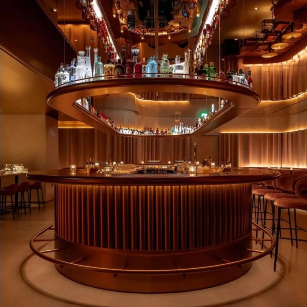 Join 100 guests at Mr Porter, Park Lane. Behind its unassuming copper door lies a world of culinary decadence and contemporary design — a subterranean hideaway where mirror-polished surfaces, velvet textures and golden light create an atmosphere that is both intimate and electrifying